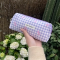 Detail of purple plaid canvas pouch with pink bow prints and May Rabbit label - Purple