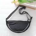 Detail of black dumpling bag with striped strap and curved white trim decoration - Black