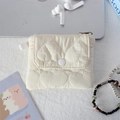 Close-up of quilted heart pattern organizer pouch with snap button and white carry strap - Quilted Large Heart Beige White