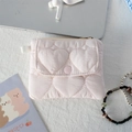 Detail of pink quilted wallet with heart pattern and snap button on textured fabric - Quilted Large Heart Light Pink