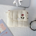 Detail of cream quilted mini pouch featuring a cute red mushroom embroidery and snap button - Quilted Embroidered Mushroom