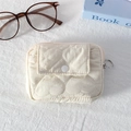 Close-up of cream quilted mini pouch with heart pattern and secure button flap - Quilted Large Heart Beige White
