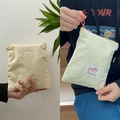 Pochette de rangement en toile beige avec broderie Jolly et détails de fermeture roses - Poche zippée