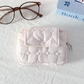 Close-up of pink quilted mini pouch with heart patterns and circular metal zipper pull - Quilted Large Heart Light Pink