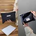 Portable black nylon macaron pouch with colorful zipper and ring puller for storage - Black