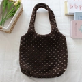 Detailed view of plush sherpa tote bag with heart pattern on rustic background - Brown Small Heart