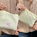 Light beige macaron fabric makeup bag with jolly label and secure zipper closure - Light Yellow