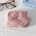Detailed close-up of pink quilted mini coin purse with button pocket and zipper ring - Quilted Pleated Pink