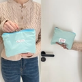 Mint green nylon storage bag with blue zipper and hi jolly label for cosmetics - Aqua Green
