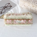 Close-up of soft plush pencil case with colorful stripes and secure zipper closure - Yellow Pink Striped Plush