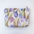 Floral makeup bag featuring purple and blue tulip patterns with a zipper closure - Purple Tulip