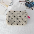 Close-up of cream faux shearling makeup bag with black polka dots and pink lanyard - Beige Black Small Heart