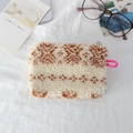 Detailed close-up of fluffy cream plush pouch with vintage brown geometric patterns - Ethnic Style Beige Totem
