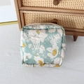 Floral makeup pouch with pastel flowers and zipper detail on a rustic background - Egg Yolk Flower