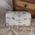 Detail of white quilted cosmetic bag featuring cute cartoon elephant print and soft texture - Cute Elephant