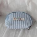 Detailed view of mini stripe makeup bag featuring bow embroidery and smooth zipper - Blue White Stripe Blue Bow