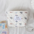 Detail of quilted cotton makeup bag featuring cute elephant patterns and soft texture - Cute Elephant