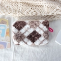 Detail of plush checkered makeup bag with soft fleece texture and sturdy metal zipper - Brown Coffee Argyle