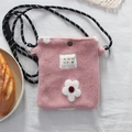 Detailed macro view of a cute pink plush flower bag with woven strap and metal snap - Flower / Pink