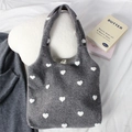 Detailed view of grey wool tote bag featuring white heart embroidery and plaid lining - Heart Grey