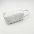 White wave quilted polyester makeup bag with handle and zipper closure - White