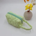 Pale green quilted floral cosmetic bag with contrasting blue zipper and soft handle - Light Green