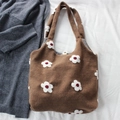 Close-up of brown textured tote bag featuring floral embroidery and snap button closure - Flower Brown