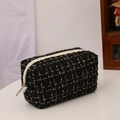 Black and gold tweed makeup pouch with white zipper and premium woven texture - Tweed Black / Black