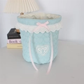 Detailed close-up of light blue heart quilted storage basket with lace and pink ribbon - Quilted Heart Light Blue