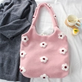 Pink knit tote bag with white flower details and plaid lining on a cozy textile background - Flower Pink