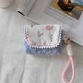 Detailed close-up of a floral fabric camera case and earphone pouch with pink lanyard - Crepe Striped Heart Blue