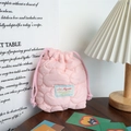 Close-up of pink quilted drawstring storage bag with Love Mayrabbit woven label - Quilted Cloud Pink