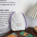 Detail of white quilted drawstring pouch with purple cord and padded bubble texture - Quilted Cloud Milky White