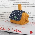 Detail of yellow corduroy coin purse featuring blue star pattern and green button accent - Corduroy Ginger Yellow