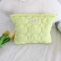 Detail of light green quilted cloud bag with mayrabbit label and zipper closure - Makeup Bag / Yellow