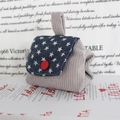 Detailed view of grey corduroy mini pouch with navy star denim flap and red button - Corduroy Grey