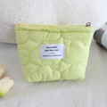 Detail of light green quilted cosmetic bag with cloud texture and metal zipper closure - Lipstick Pouch / Yellow