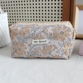 Macro detail of lavender embossed jacquard pencil case with daisy floral patterns - Shiny Silk Cosmos Yellow