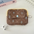 Macro view of floral corduroy coin purse with yellow zipper and front snap pocket - Brown Diamond Lattice Flower
