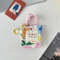 Détail de la mini pochette florale avec lanières pastel et bouton-pression - Jardin de Printemps Floral