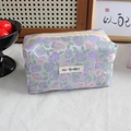 Detail of floral jacquard fabric on a large capacity green stationery pouch with zipper - Purple Pink Camellia Rose