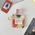 Détail d'une pochette pour écouteurs en tissu floral avec bouton et crochet de voyage - Floral Rouge et Vert
