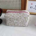 Detail of floral embroidery texture and white woven label on the jacquard pencil case - Pink Green Floral