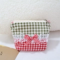 Detailed view of lace trim and gingham bow on the sweet fabric cosmetic handbag - Lace Splicing Lipstick Bag / Green and Red Plaid