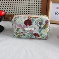 Detail of vintage floral jacquard fabric texture on a large capacity makeup storage bag - Green Pastoral