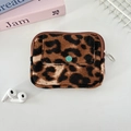 Close-up of leopard print corduroy coin purse with a green button flip pocket - Retro Brown Leopard