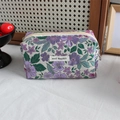 Close-up of floral jacquard fabric and high-quality zipper on this large storage pouch - White Base Purple Floral