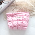 Pink quilted lipstick bag featuring May Rabbit label and elegant lace backdrop - Bubble Check Pink