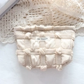Detail of cream quilted bubble fabric makeup bag with May Rabbit label and zipper - 3D Bubble Grid Khaki