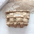 Detailed texture of beige quilted puff cosmetic bag with ribbon trim and woven label - 3D Bubble Grid Dark Khaki